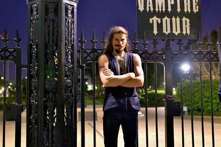 a person standing in front of a fence