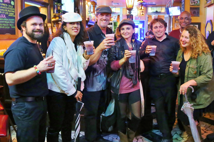 Group posing for photo in bar