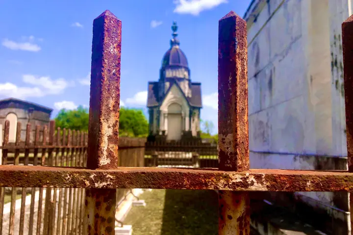 a tall building with a metal fence