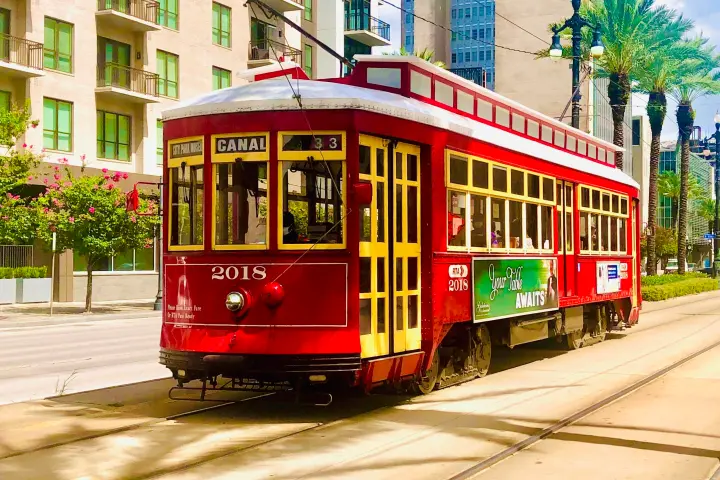 a train driving down the street
