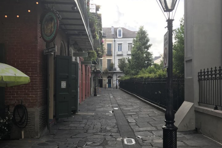 a clock on the side of the street