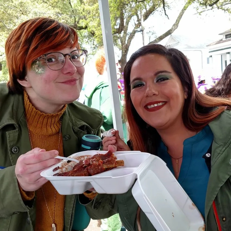 a couple of people that are eating some food