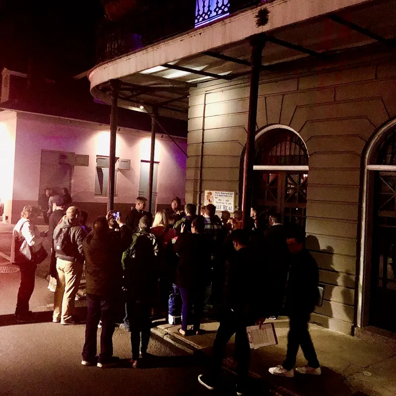 a group of people walking down the street