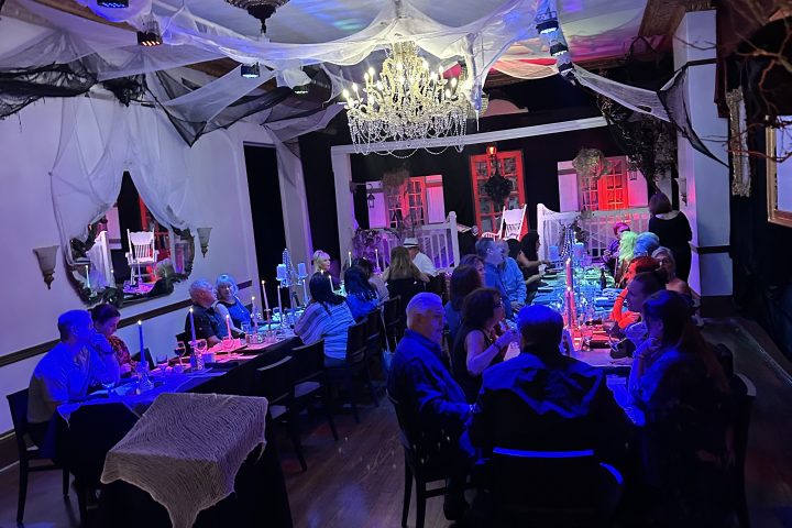 a group of people on a stage in front of a crowd