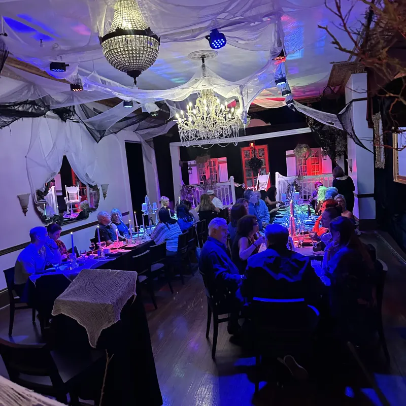 a group of people on a stage in front of a crowd